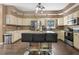 Well-appointed kitchen with a center island, ample storage, and modern stainless appliances at 3841 Rawls Church Rd, Fuquay Varina, NC 27526