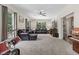 Spacious living room bathed in natural light with plush seating and views into the backyard; perfect for comfort at 3841 Rawls Church Rd, Fuquay Varina, NC 27526