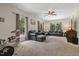 Comfortable living room with large windows for natural light and carpeted flooring offers a relaxing atmosphere at 3841 Rawls Church Rd, Fuquay Varina, NC 27526