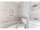 Well-lit bathroom features decorative tiled walls, tub and shower combination and a vanity at 403 S Webb St, Selma, NC 27576