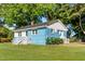 Charming single-story home with blue painted brick and lush green lawn at 403 S Webb St, Selma, NC 27576