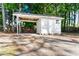 Backyard shed with parking stall and small fenced area at 403 S Webb St, Selma, NC 27576