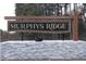 Elegant community sign for Murphys Ridge set against a serene wooded backdrop at 4456 Poppy Mallow Ln, Oxford, NC 27565