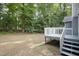 Backyard featuring a large deck and lush trees, making it an outdoor retreat at 5008 Dantonville Ct, Knightdale, NC 27545