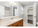 Bright bathroom with large mirror, convenient vanity and access to the shower and walk-in closet at 5008 Dantonville Ct, Knightdale, NC 27545