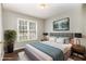 Cozy bedroom featuring neutral tones, comfortable Queen bed and plenty of natural light from the window at 5008 Dantonville Ct, Knightdale, NC 27545