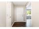Bright foyer with dark wood floors and a view into the living area, providing a welcoming entrance at 5008 Dantonville Ct, Knightdale, NC 27545