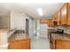 Functional kitchen featuring oak cabinets, granite countertops, and stainless-steel appliances at 5008 Dantonville Ct, Knightdale, NC 27545
