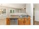 This open kitchen features stainless steel appliances, granite countertops, and a stainless steel sink at 5008 Dantonville Ct, Knightdale, NC 27545
