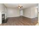 Spacious living room with hardwood flooring and a cozy fireplace, perfect for gatherings at 5008 Dantonville Ct, Knightdale, NC 27545