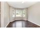 Bright living room with updated flooring and large bay window offering lots of natural light at 5008 Dantonville Ct, Knightdale, NC 27545