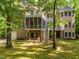 Charming brick home featuring an outdoor patio and a screened in porch in the backyard at 540 Vista Del Lago Ln, Wake Forest, NC 27587