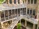 Multi-story brick home featuring screen porch, patio, and outdoor dining, perfect for entertaining at 540 Vista Del Lago Ln, Wake Forest, NC 27587