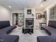 Finished basement lounge area featuring a fireplace, seating, and stylish decor at 540 Vista Del Lago Ln, Wake Forest, NC 27587