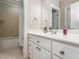 Bathroom featuring a white vanity, neutral tile, and tub shower combination at 540 Vista Del Lago Ln, Wake Forest, NC 27587