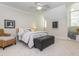Bedroom featuring a wicker chair and ottoman in front of a large window at 540 Vista Del Lago Ln, Wake Forest, NC 27587