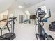 Spacious exercise room with various workout equipment and an elliptical machine at 540 Vista Del Lago Ln, Wake Forest, NC 27587