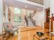 Spacious foyer with hardwood floors, staircase and large window providing ample natural light at 540 Vista Del Lago Ln, Wake Forest, NC 27587