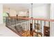 Upstairs hallway with detailed iron railing overlooking the staircase and first floor at 540 Vista Del Lago Ln, Wake Forest, NC 27587
