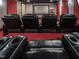 A home theater offers comfortable recliners and cup holders for the ultimate movie experience at 540 Vista Del Lago Ln, Wake Forest, NC 27587