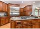 Spacious kitchen with large island, stainless steel refrigerator, custom cabinetry, and modern appliances at 540 Vista Del Lago Ln, Wake Forest, NC 27587