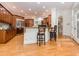 Spacious kitchen featuring wood cabinets, granite countertops, stainless steel appliances, and a breakfast bar at 540 Vista Del Lago Ln, Wake Forest, NC 27587