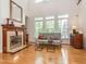 Spacious living room with hardwood floors, fireplace and large windows providing ample natural light at 540 Vista Del Lago Ln, Wake Forest, NC 27587