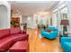 Bright living room featuring hardwood floors, comfortable seating, large windows, and an open concept layout at 540 Vista Del Lago Ln, Wake Forest, NC 27587