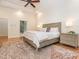 Spacious main bedroom featuring hardwood floors, tray ceiling, a ceiling fan and a light color scheme at 540 Vista Del Lago Ln, Wake Forest, NC 27587