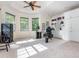 Bright home office featuring built-in shelving, modern desk, and large windows with plenty of natural light at 540 Vista Del Lago Ln, Wake Forest, NC 27587