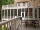 Outdoor patio featuring a dining table and chairs and view of a screened in porch at 540 Vista Del Lago Ln, Wake Forest, NC 27587