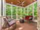 Relaxing screened porch with comfortable seating and views of the surrounding greenery at 540 Vista Del Lago Ln, Wake Forest, NC 27587
