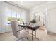 Bright home office with a comfortable chair, modern desk, and a view to the outdoors at 60 Lismore St, Sanford, NC 27330