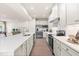 Modern kitchen featuring a long center island, stainless steel appliances, and lots of cabinetry at 60 Lismore St, Sanford, NC 27330