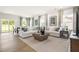 Bright and airy living room featuring a large sectional sofa, neutral decor, and plenty of natural light at 60 Lismore St, Sanford, NC 27330