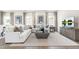 Cozy living room featuring comfortable seating, stylish decor, and a large TV at 60 Lismore St, Sanford, NC 27330