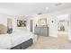 Spacious main bedroom featuring soft carpet, a gray dresser, and access to additional rooms at 60 Lismore St, Sanford, NC 27330