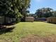Open backyard with a shed and plenty of green grass for outdoor activities at 603 Hugo St, Durham, NC 27704