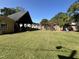 Large backyard with a wooden structure, a grill, and plenty of green space at 603 Hugo St, Durham, NC 27704