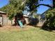 Backyard features a playhouse and a slide, offering a fun outdoor space at 603 Hugo St, Durham, NC 27704
