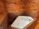 Wood paneled bathroom featuring large jacuzzi tub at 603 Hugo St, Durham, NC 27704