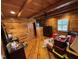 Wood-paneled bedroom featuring hardwood floors, a TV, and natural light from a window at 603 Hugo St, Durham, NC 27704