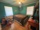 Cozy bedroom features hardwood floors, light-filled windows, and a ceiling fan at 603 Hugo St, Durham, NC 27704
