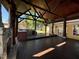 The huge, covered deck is the ultimate outdoor entertainment space with wood ceilings and stone pillars at 603 Hugo St, Durham, NC 27704