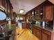 Updated kitchen featuring granite counters, wood cabinets, and stainless appliances at 603 Hugo St, Durham, NC 27704