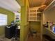 Bright laundry room with storage shelves and modern washer and dryer at 603 Hugo St, Durham, NC 27704