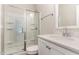 Bright bathroom with glass enclosed shower, white vanity, and modern fixtures at 66 Sweet Meadow Ln, Pittsboro, NC 27312