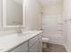 Bathroom featuring a single vanity with quartz countertops, toilet, and bathtub at 66 Sweet Meadow Ln, Pittsboro, NC 27312