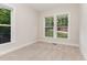 Sun-filled bedroom with large windows and neutral carpet at 66 Sweet Meadow Ln, Pittsboro, NC 27312
