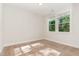 Bedroom with carpet and large window providing plenty of natural light at 66 Sweet Meadow Ln, Pittsboro, NC 27312
